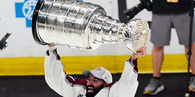 Colorado Avalanche star Nazem Kadri lifts the Stanley Cup after the team defeated the Tampa Bay Lightning 2-1 in Game 6 of the NHL hockey Stanley Cup Finals on Sunday, June 26, 2022, in Tampa, Fla.