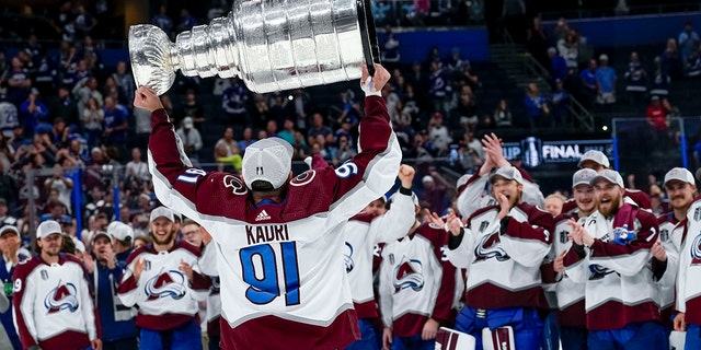 Colorado Avalanche center Nazem Kadri, #91,  hoisting the Stanley Cup during the NHL Hockey Stanley Cup Finals Game six between Tampa Bay Lightning and the Colorado Avalanche on June 26th, 2022 at Amalie Arena in Tampa Florida.
