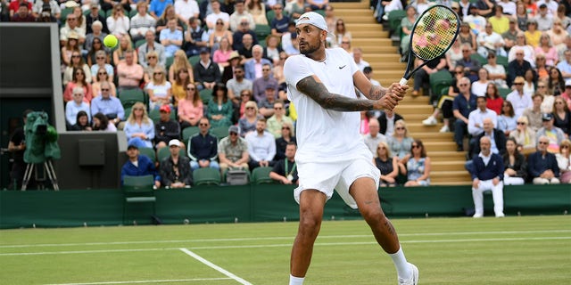 Nick Kyrgios of Australia plays a backhand against Filip Krajinovic of Serbia during their Men's Singles Second Round match on day four of The Championships Wimbledon 2022 at All England Lawn Tennis and Croquet Club on June 30, 2022 in London, England. 