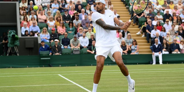 Nick Kyrgios of Australia plays a backhand against Filip Krajinovic of Serbia during their Men's Singles Second Round match on day four of The Championships Wimbledon 2022 at All England Lawn Tennis and Croquet Club on June 30, 2022 in London, England. 