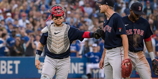 Boston Red Sox catcher Christian Vazquez backs pitcher Nick Pivetta (37) during a heated exchange with the Toronto Blue Jays after the Blue Jays' Alejandro Kirk hit the pitch during the fourth inning of a baseball game, Wednesday, June 29, 2022 Got it.  in Toronto. 