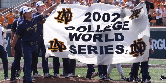 Notre Dame players celebrate after beating Tennessee in an NCAA college baseball super regional game Sunday, June 12, 2022, in Knoxville, Tenn. Notre Dame won 7-3 to advance to the College World Series. 