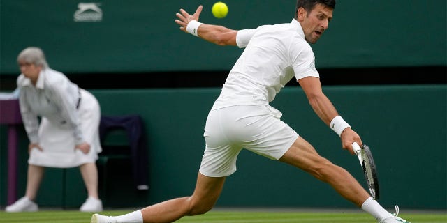 Serbia's Novak Djokovic returns to Korea's Kwon Soonwoo in a men's first round singles match on day one of the Wimbledon tennis championships in London, Monday, June 27, 2022. 