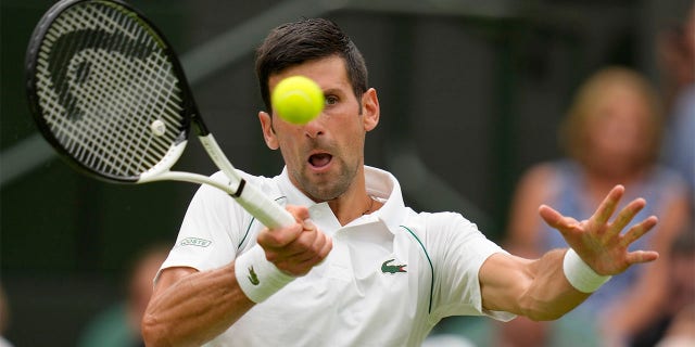 Serbia's Novak Djokovic returns to Korea's Kwon Soonwoo in a men's first round singles match on day one of the Wimbledon tennis championships in London, Monday, June 27, 2022.