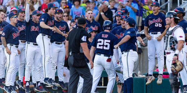 Mississippi celebrates the two run homer by Tim Elko (25) in the second inning against Mississippi during an NCAA College World Series baseball game, Monday, June 20, 2022, in Omaha, Neb. 