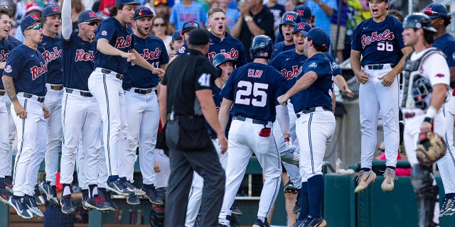 Mississippi celebrates the two run homer by Tim Elko (25) in the second inning against Mississippi during an NCAA College World Series baseball game, Monday, June 20, 2022, in Omaha, Neb. 