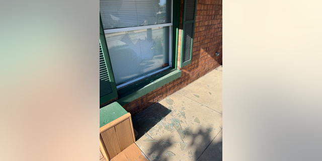 Outside view of the broken window of the shared office of Jackson Right to Life and Rep. Tim Walberg's campaign.