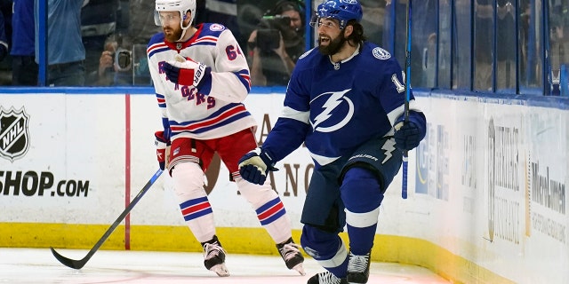 Tampa Bay Lightning left wing Pat Maroon, right, celebrates after scoring a goal in front of New York Rangers center Tyler Motte during the first period in Game 4 of the NHL Eastern Conference finals June 7, 2022, in Tampa, Fla.