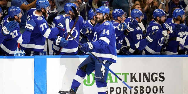 Tampa Bay Lightning left wing Pat Maroon (14) celebrates with teammates after scoring a goal against the New York Rangers during the first period in Game 4 of the NHL's Eastern Conference finals June 7, 2022, in Tampa, Fla. 