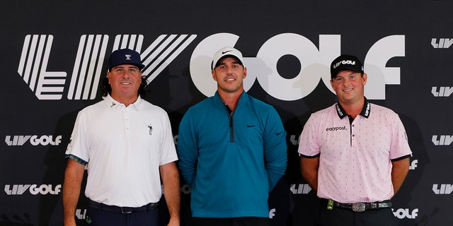 Pat Perez of the United States, Brooks Koepka of the United States and Patrick Reed of the United States pose for a photo after talking to the media during a press conference before the LIV Golf Invitational - Portland on June 28 at Pumpkin Ridge Golf Club While posing.  2022 in Northern Plains, Oregon.