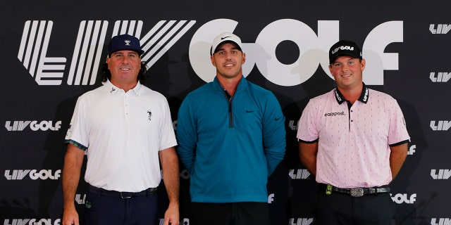 Pat Perez of the United States, Brooks Koepka of the United States and Patrick Reed of the United States pose for a photo after speaking to the media during a press conference  prior to the LIV Golf Invitational - Portland at Pumpkin Ridge Golf Club on June 28, 2022 in North Plains, Oregon.