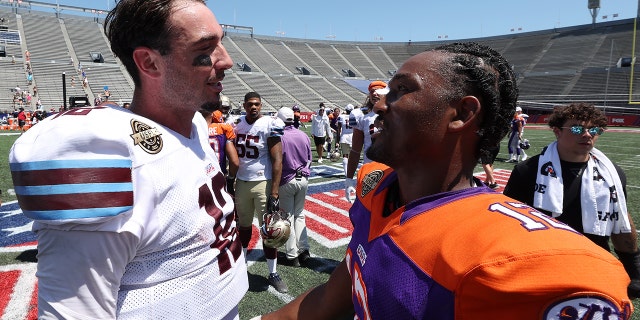 Paxton Lynch #12 of the Michigan Panthers and Vad Lee #12 of the Pittsburgh Maulers talk on the field after the Michigan Panthers defeated the Pittsburgh Maulers 33-21 at Legion Field on June 19, 2022 in Birmingham, Alabama.