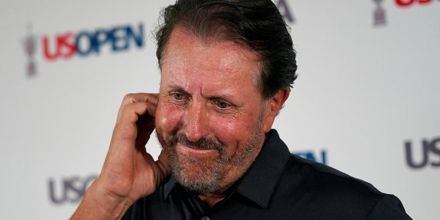 Phil Mickelson ponders a question at a press conference, Monday, June 13, 2022, at The Country Club in Brookline, Mass., ahead of the U.S. Open golf tournament.