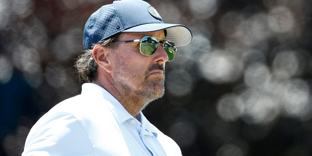 Phil Mickelson looks on from the 16th tee during a practice round prior to the 122nd U.S. Open on June 15, 2022, in Brookline, Massachusetts.