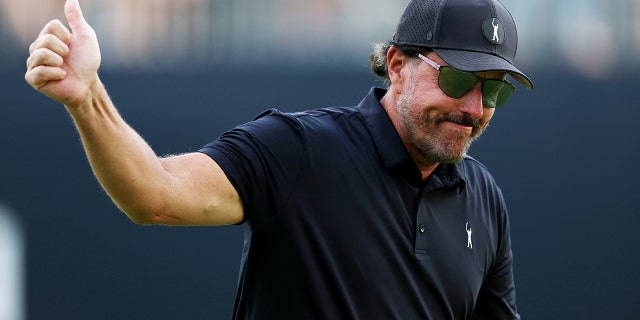 Phil Mickelson of the United States gives a thumbs up as he walks off the 18th green during round one of the 122nd U.S. Open Championship at The Country Club on June 16, 2022 in Brookline, Massachusetts.