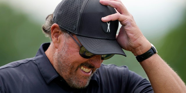 Phil Mickelson walks on the fourth hole during the first round of the U.S. Open golf tournament at The Country Club, Thursday, June 16, 2022, in Brookline, Mass.