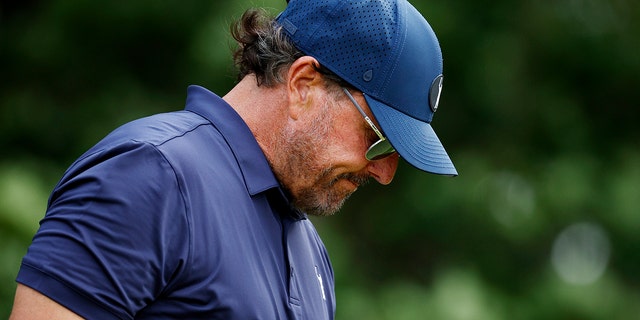 Phil Mickelson of the United States exits his 15th T-shirt during the second round of the 122nd US Open Championships at The Country Club on June 17, 2022 in Brookline, Mass.
