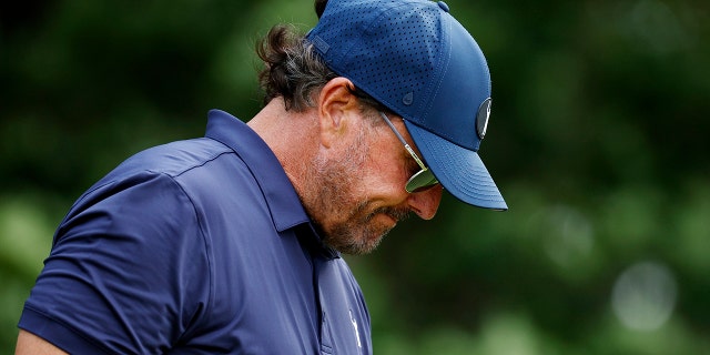 Phil Mickelson of the United States walks off the 15th tee during the second round of the 122nd U.S. Open Championship at The Country Club June 17, 2022, in Brookline, Mass.