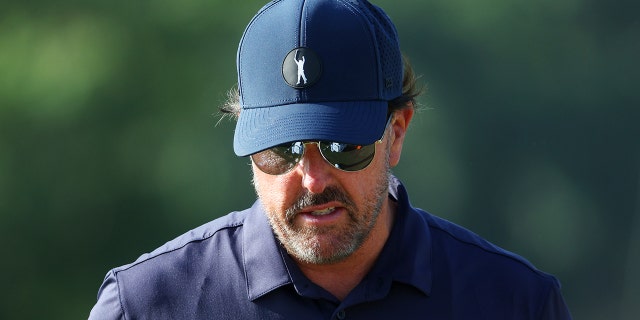 Phil Mickelson of the United States stands on the practice range during the second round of the 122nd U.S. Open Championship at The Country Club June 17, 2022, in Brookline, Mass.