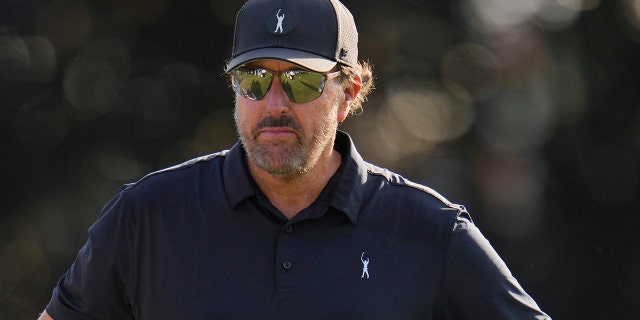 Phil Mickelson waits to hit on the 16th hole during the first round of the U.S. Open golf tournament at The Country Club, Thursday, June 16, 2022, in Brookline, Mass.