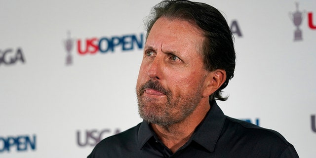 Phil Mickelson ponders a question at a press conference, Monday, June 13, 2022, at The Country Club in Brookline, Massachusetts, ahead of the U.S. Open golf tournament. 