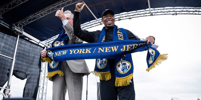 New Jersey Gov. Phil Murphy, left, and New York City Mayor Eric Adams speak at the 2026 FIFA World Cup host city selection watch party at Liberty State Park in Jersey City, Thursday, June 16, 2022.