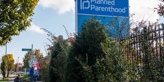 Protesters pray outside a Planned Parenthood location in Columbus, Ohio, Nov. 12, 2021.