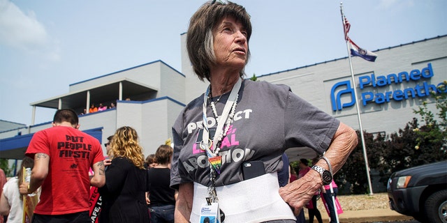 A 20-year employee of Planned Parenthood waits for a rally to start after a judge granted a temporary restraining order on the closing of Missouri's sole remaining Planned Parenthood clinic in St. Louis May 31, 2019.