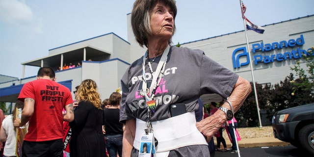 A 20-year employee of Planned Parenthood waits for a rally to start after a judge granted a temporary restraining order on the closing of Missouri's sole remaining Planned Parenthood clinic in St. Louis May 31, 2019.