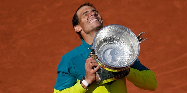 Spain's Rafael Nadal lifts the trophy after winning the final match against Norway's Casper Ruud in three sets, 6-3, 6-3, 6-0, at the French Open at Roland Garros stadium in Paris Sunday, Junie 5, 2022.