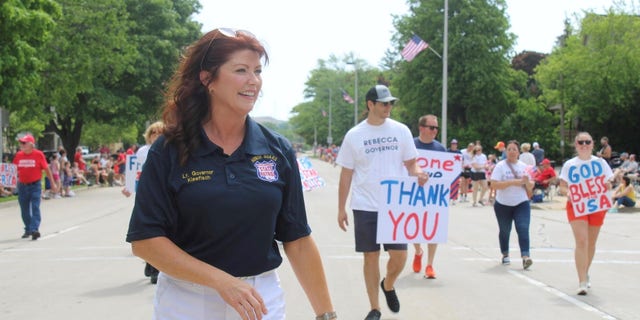 Former Lt. Gov. Rebecca Kleefisch, who's running for the Republican gubernatorial nomination, marches in a Memorial Day Parade on May 30, 2022, in Menomonee Falls, Wisconsin.