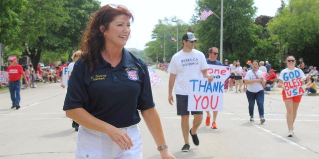 Former Lt. Gov. Rebecca Kleefisch, who's running for the Republican gubernatorial nomination, marches in a Memorial Day Parade on May 30, 2022, in Menomonee Falls, Wisconsin.