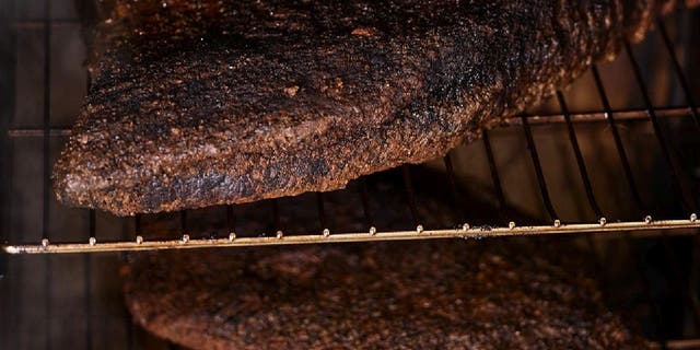 Classic smoked beef brisket is cooked in a smoker between 10.5 and 12 hours.