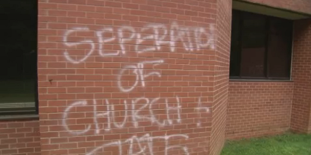 One of the messages found written on the side of the church. 