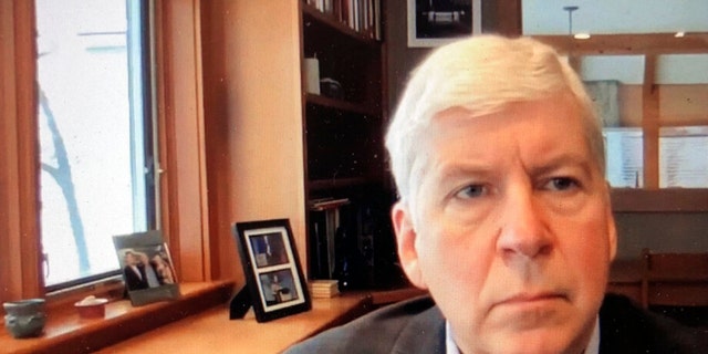 This screen shot from video, shows former Michigan Gov. Rick Snyder, during his Zoom hearing in the 67th District Court in Flint, Mich., on Jan. 18, 2020.