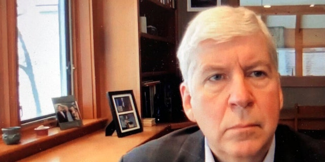 This screen shot from video, shows former Michigan Gov. Rick Snyder, during his Zoom hearing in the 67th District Court in Flint, Mich., on Jan. 18, 2020.