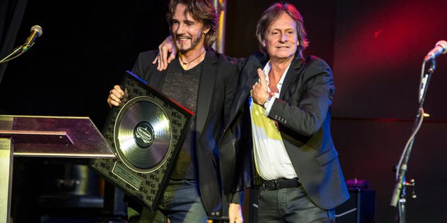 Rick Springfield presents award to Brett Tuggle at the RockGodz Hall Of Fame Annual Induction Ceremony at The Canyon Club on Oct. 27, 2019 in Agoura Hills, California.
