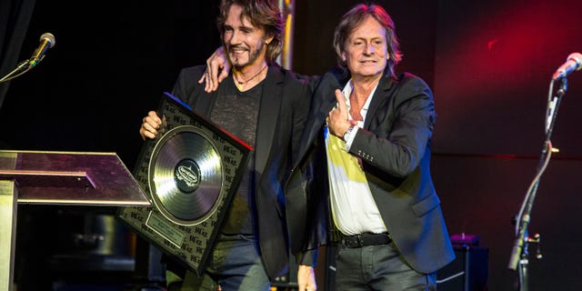 Rick Springfield presents award to Brett Tuggle at the RockGodz Hall Of Fame Annual Induction Ceremony at The Canyon Club on Oct. 27, 2019 in Agoura Hills, California. 