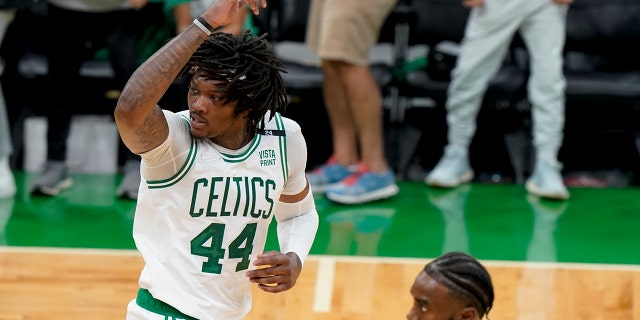 Boston Celtics center Robert Williams III reacts during the fourth quarter of theNBA Finals against the Golden State Warriors, Wednesday, June 8, 2022, in Boston.