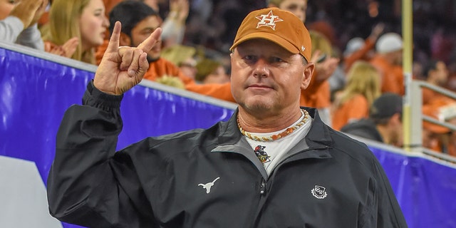 Former UT Longhorn pitcher, Houston Astro and 7-time Cy Young winner Roger Clemens gives a Hook 'Em Horns sign from the sideline during the Texas Bowl game between the Texas Longhorns and the Missouri Tigers on December 27, 2017 at NRG Stadium in Houston, Texas.