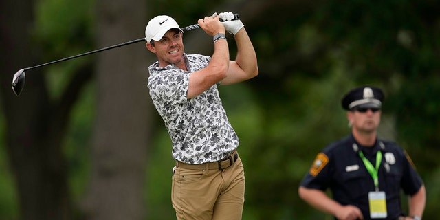 Rory McIlroy, of Northern Ireland, watches his shot on the fourth hole during the first round of the U.S. Open golf tournament at The Country Club, Thursday, June 16, 2022, in Brookline, Mass. 