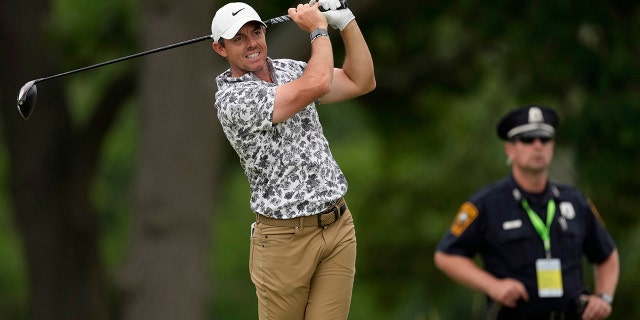 Rory McIlroy, of Northern Ireland, watches his shot on the fourth hole during the first round of the U.S. Open golf tournament at The Country Club, Thursday, June 16, 2022, in Brookline, Mass.