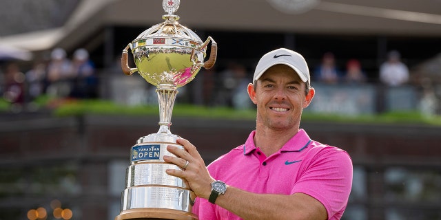 Rory McIlroy hoists the trophy after winning the Canadian Open in Toronto on Sunday, June 12, 2022.