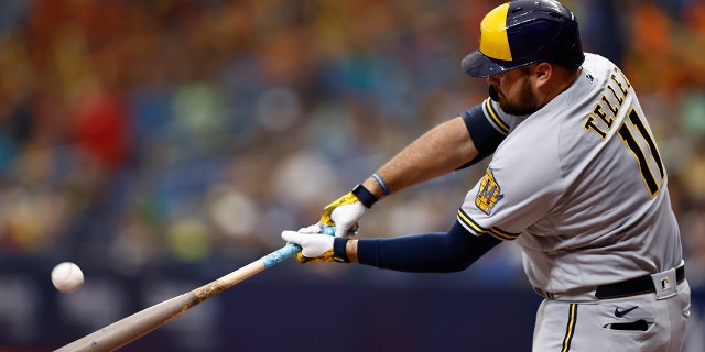 Rowdy Tellez #11 of the Milwaukee Brewers hits a solo home run during the eighth inning against the Tampa Bay Rays at Tropicana Field on June 29, 2022 in St Petersburg, Florida.