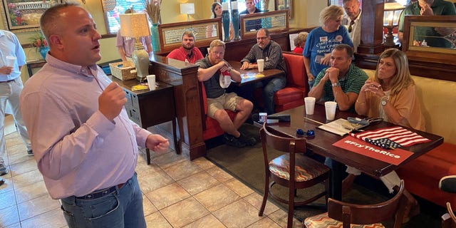 Republican candidate Russell Fry speaks with supporters at a campaign event on the eve of the state's primary elections on June 13, 2022 in Florence, South Carolina.