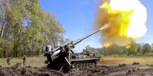 In this handout photo released by Russian Defense Ministry Press Service released on Sunday, June 5, a Pion artillery system of the Russian military fires at a target in an undisclosed location in Ukraine.