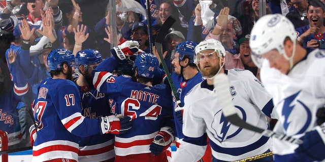 Ryan Lindgren #55 of the New York Rangers celebrates his second period goal with teammates against the Tampa Bay Lightning in Game Five of the Eastern Conference Final of the 2022 Stanley Cup Playoffs at Madison Square Garden on June 9, 2022 in New York City.