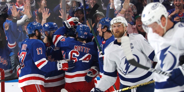 Ryan Lindgren #55 of the New York Rangers celebrates his second period goal with teammates against the Tampa Bay Lightning in Game Five of the Eastern Conference Final of the 2022 Stanley Cup Playoffs at Madison Square Garden on June 9, 2022 in New York City.