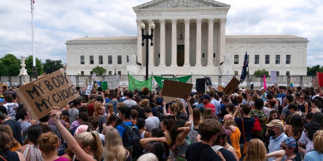 Abortion-rights protesters gather outside the Supreme Court in Washington, Friday, June 24, 2022. The Supreme Court has ended constitutional protections for abortion that had been in place nearly 50 years, a decision by its conservative majority to overturn the court's landmark abortion cases . 