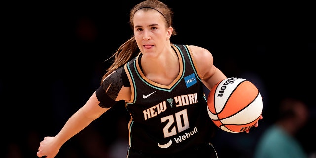 New York Liberty guard Sabrina Ionescu looks to pass against the Connecticut Sun during a WNBA game May 7, 2022, in New York.